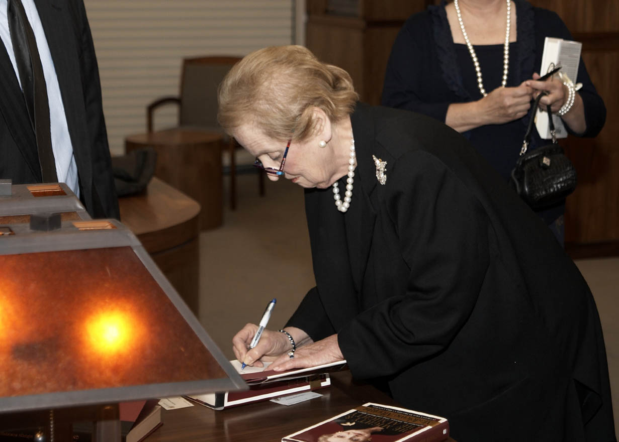 Madeleine Albright signing a copy of her book