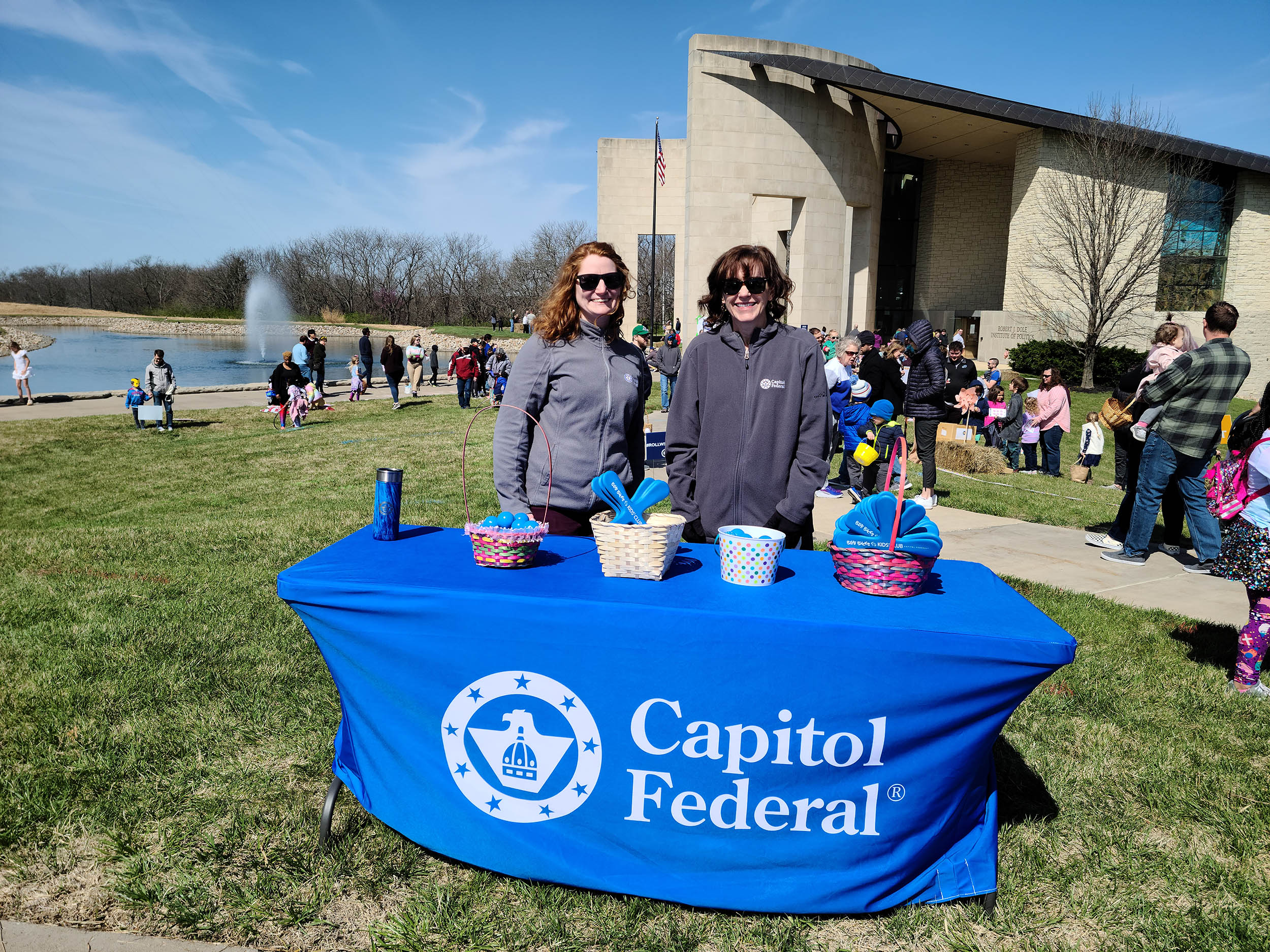 Representatives from Capitol Federal at a table set up outside the Dole Institute