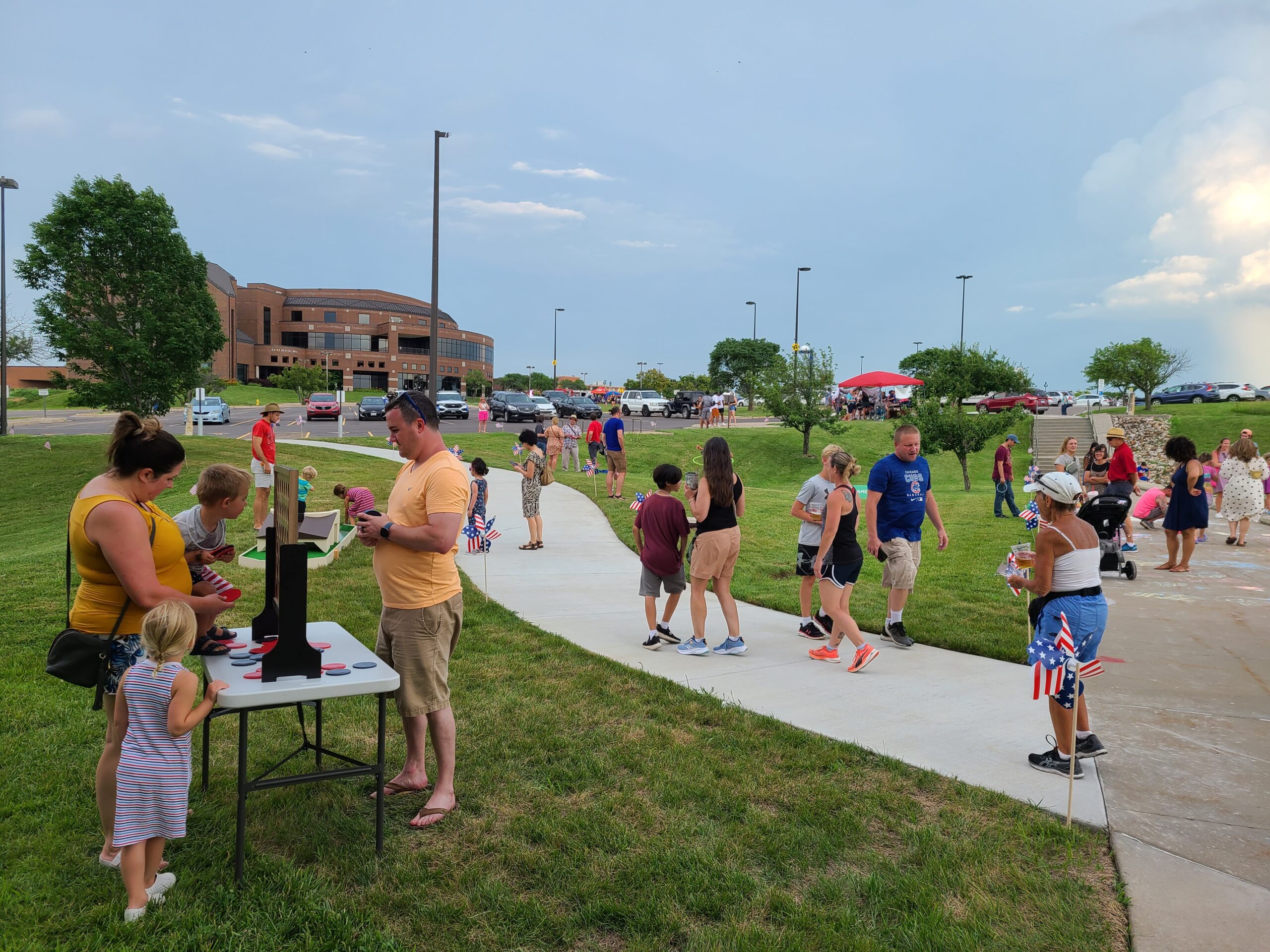 parents and children on the lawn and sidewalks outside the Dole Institute