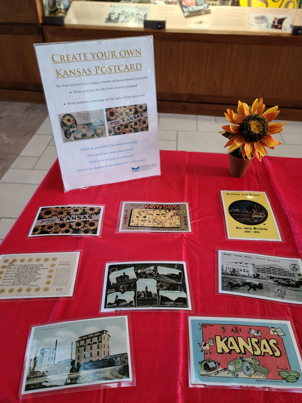 Table display shows Kansas themed postcards for the make your own postcard activity.