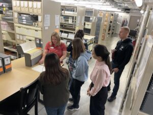 KU students analyze a manuscript stored in the Robert and Elizabeth Dole Archives and Special Collections.